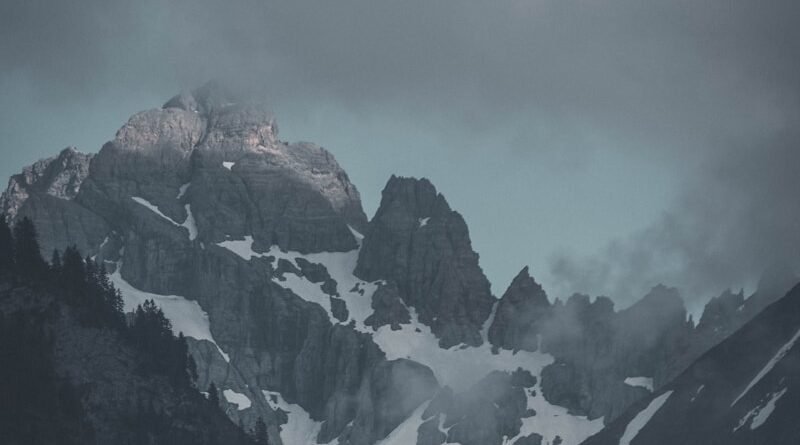 photography of mountain beside forest