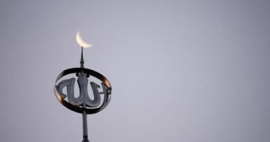 a close up of a clock on top of a building