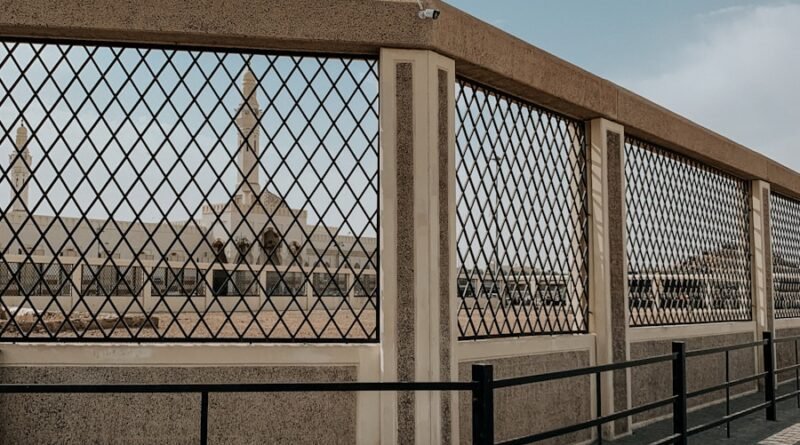 a metal fence with a metal gate