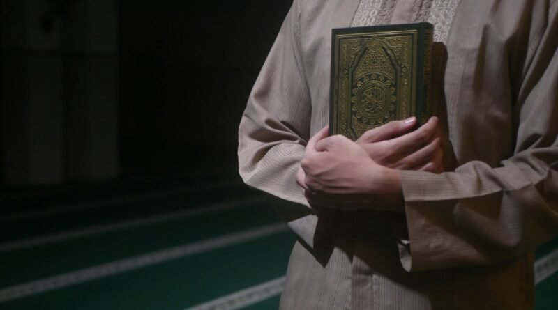 man hugging gold book