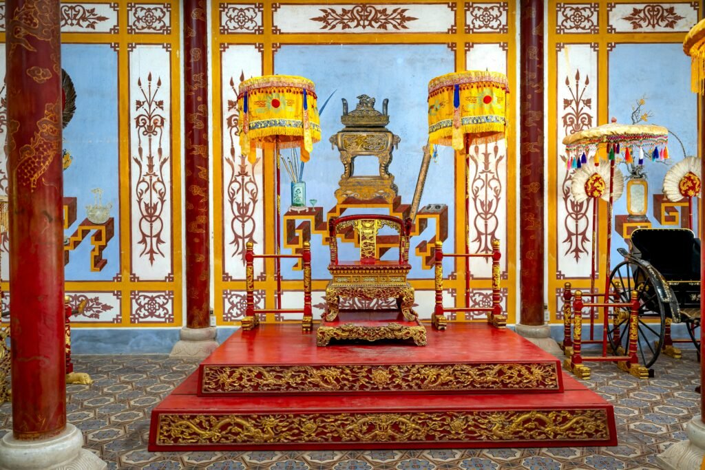 Colorful and ornate imperial throne room in historic Hue, Vietnam.