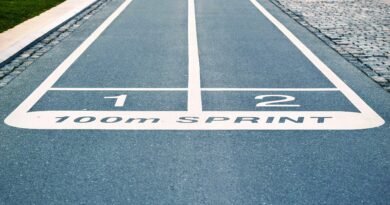 Close-up of outdoor 100m sprint track lanes, perfect for athletics and sprinting events.