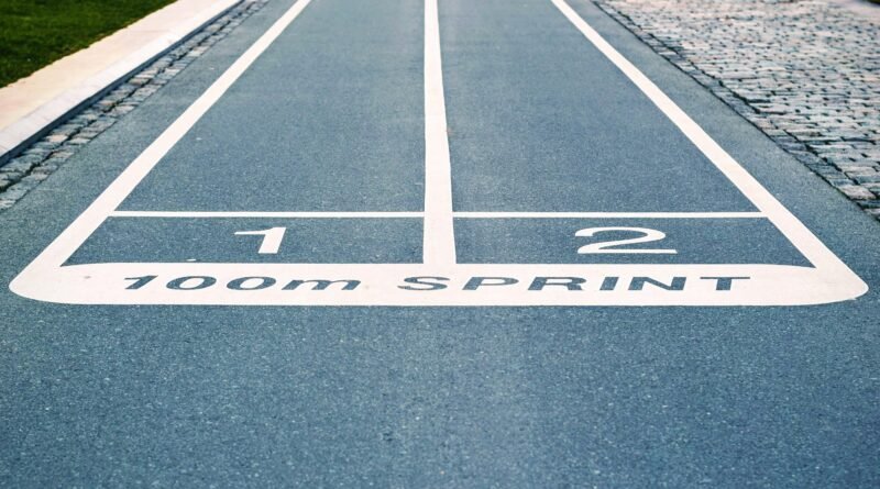Close-up of outdoor 100m sprint track lanes, perfect for athletics and sprinting events.