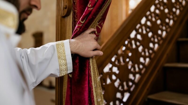 Muslim man in traditional attire holding a mosque curtain, showcasing Islamic cultural elements.